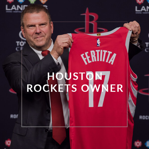 Tilman holds up his very own Houston Rockets jersey after buying the team for $2.2 billion dollars earlier this year.